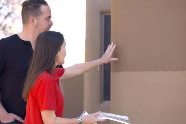 woman choosing stucco texture for their house